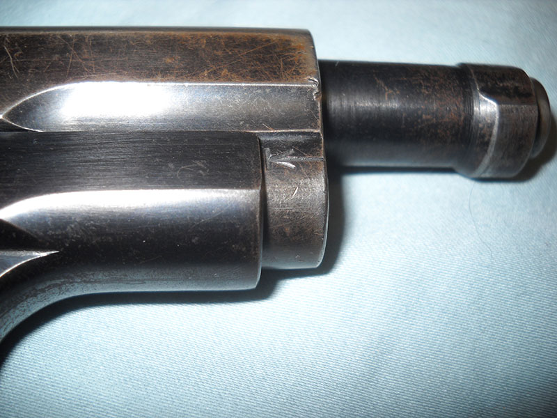 detail, takedown helper mark on Colt 1903